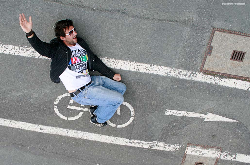man pretending to ride chalk drawing of bicycle